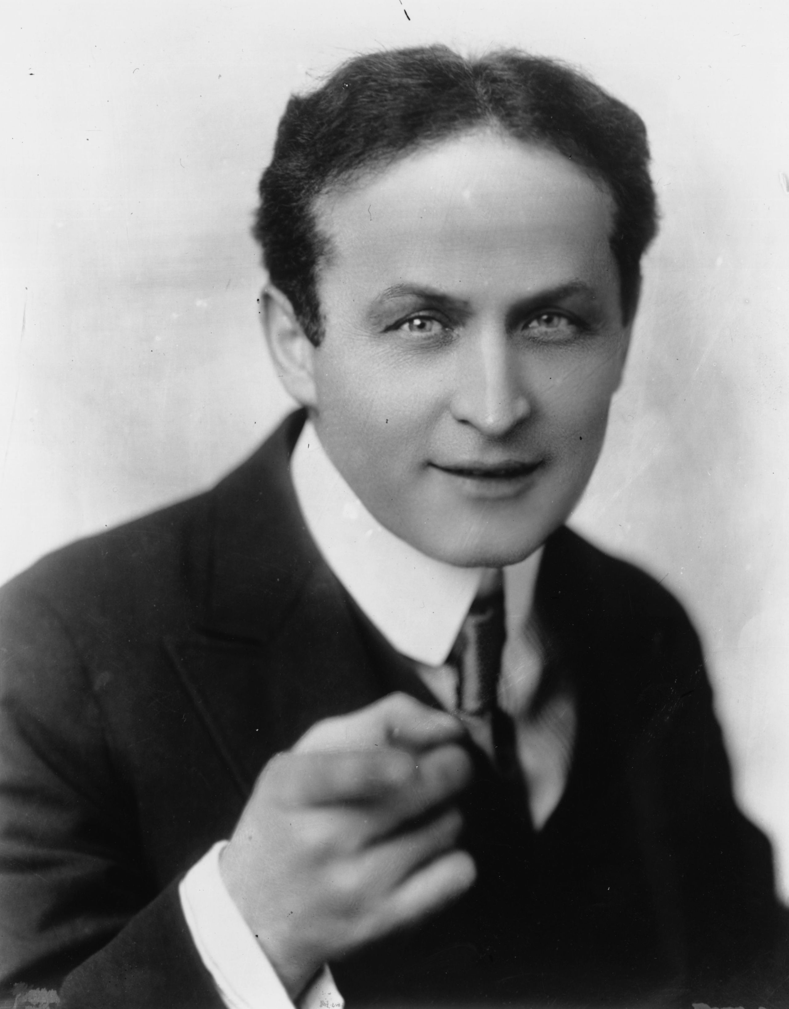 Black and white portrait of Harry Houdini, magician and escape artist