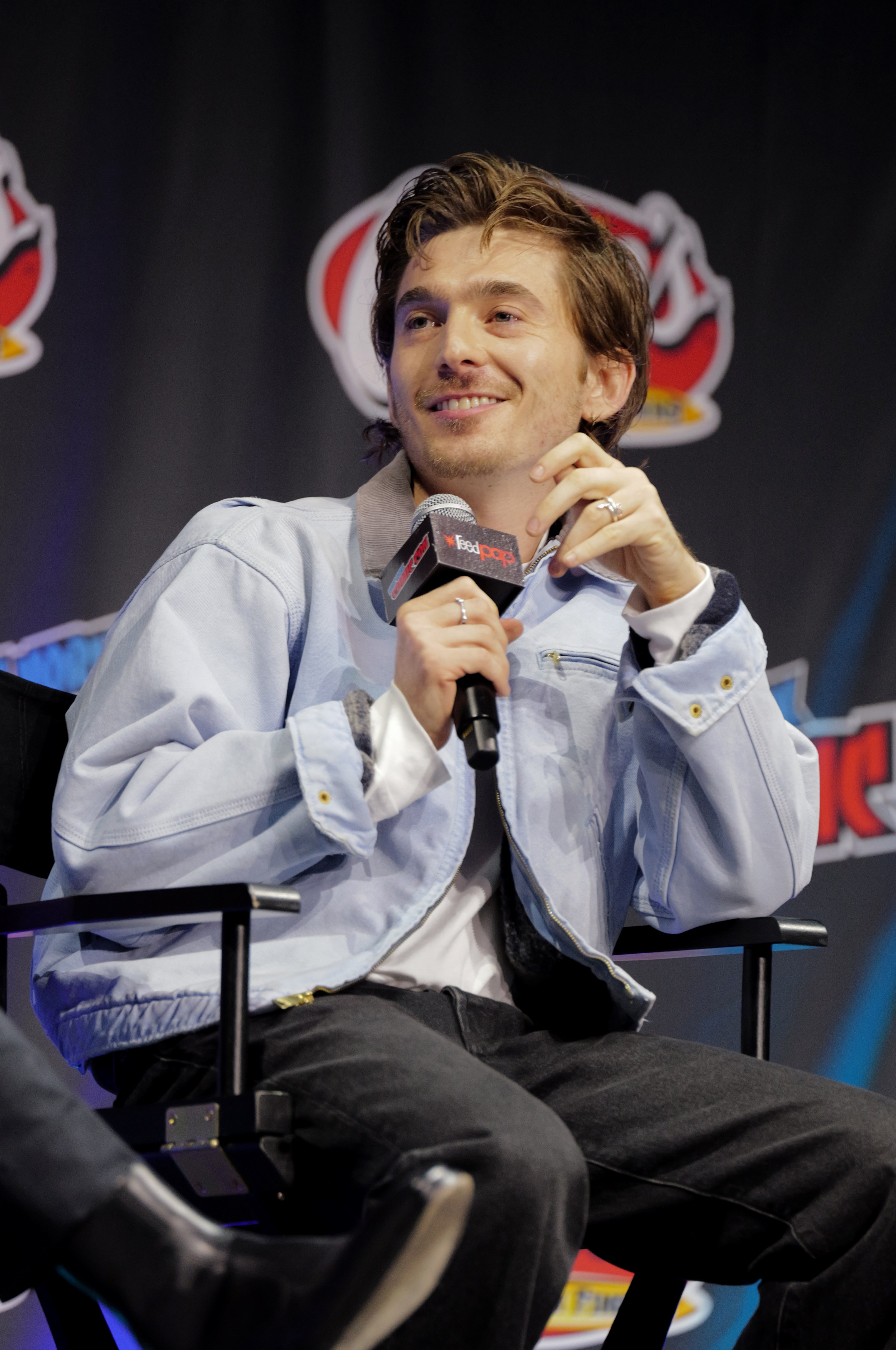 Austin Abrams speaking at the Whalefall panel at New York Comic Con 2026 inside Javits Center
