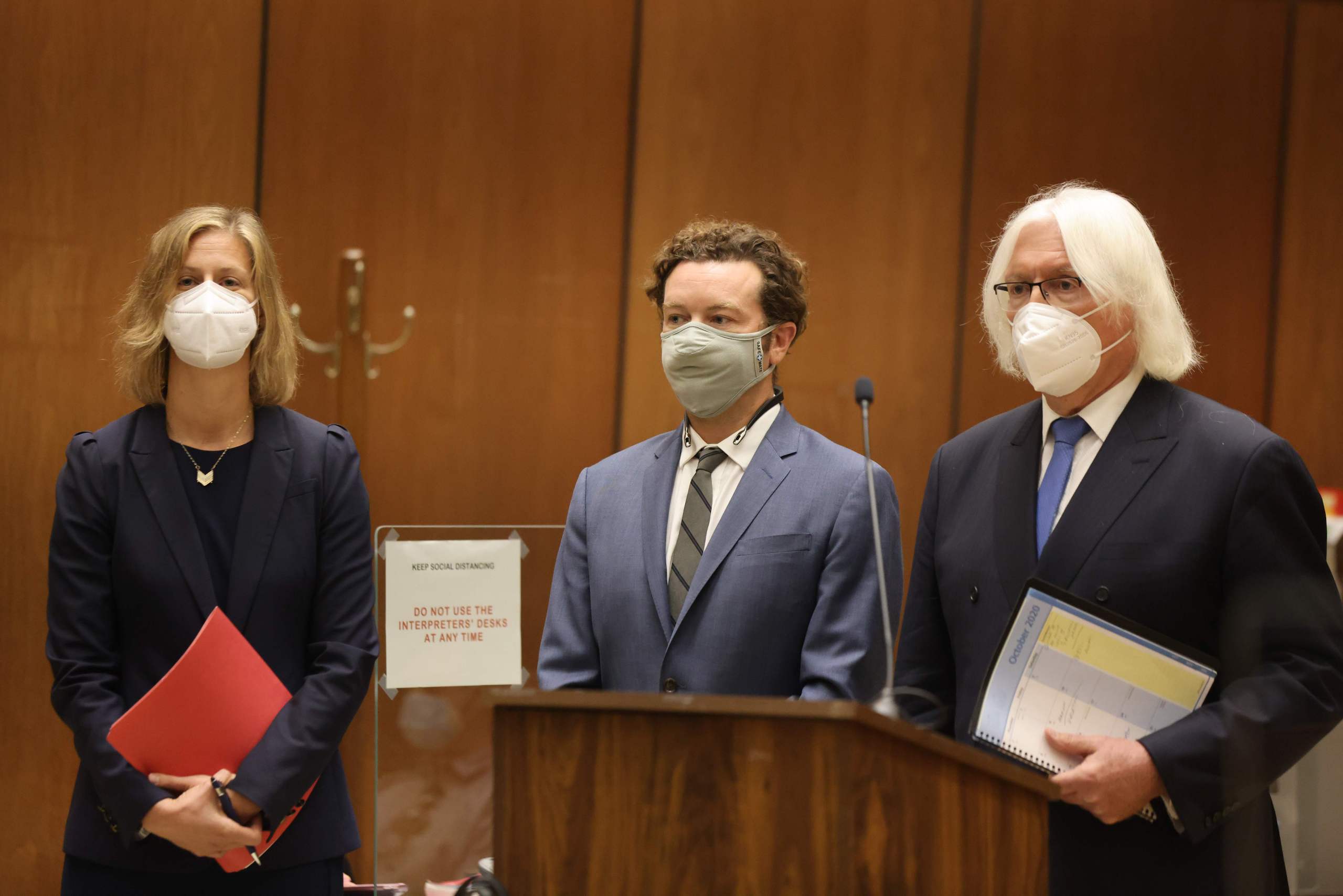 Danny Masterson standing with his two lawyers at his arraignment in Los Angeles Superior Court in September 2020