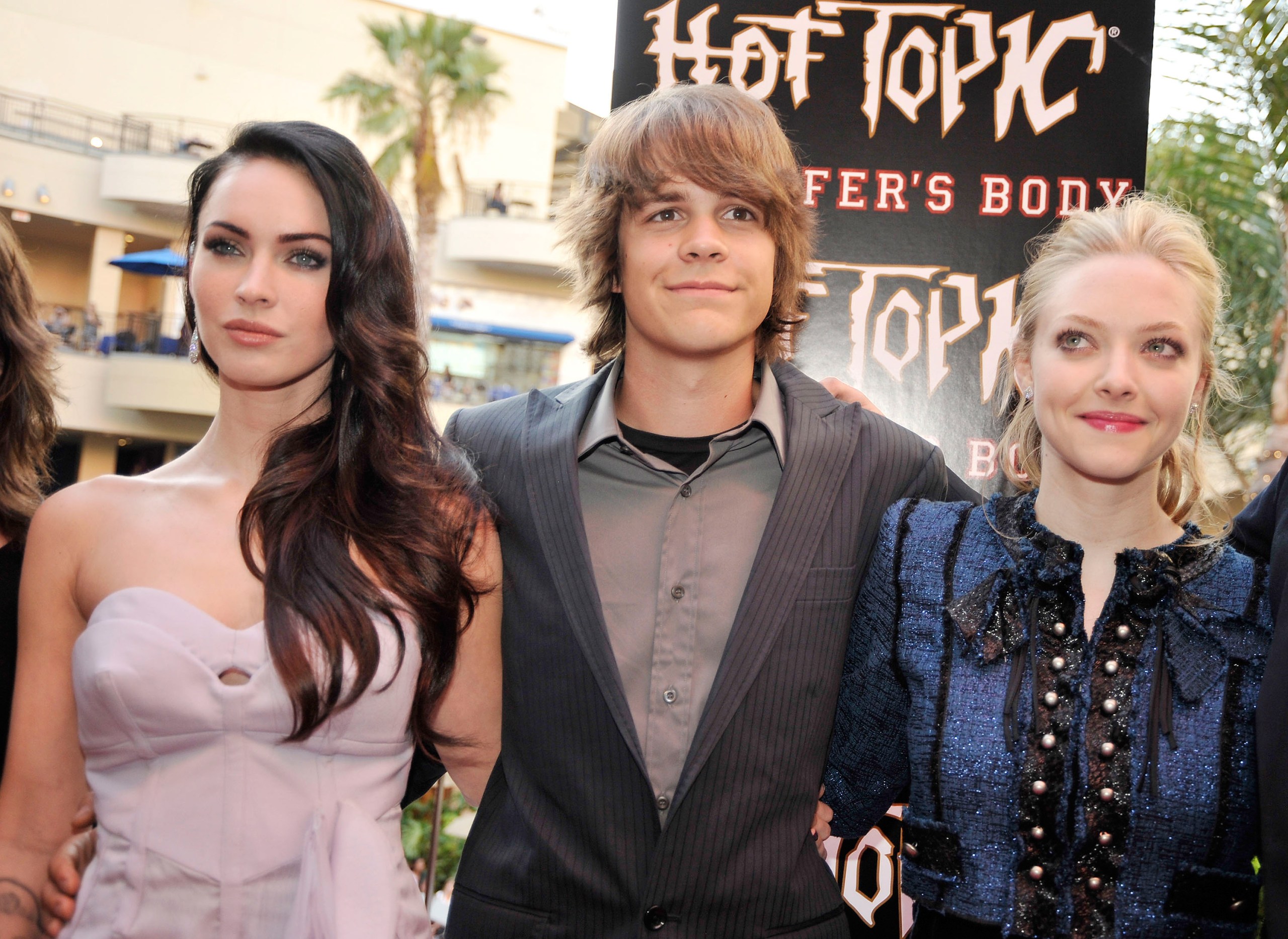 Megan Fox, Johnny Simmons, and Amanda Seyfried posing together at a Jennifer's Body fan event in Los Angeles in 2009