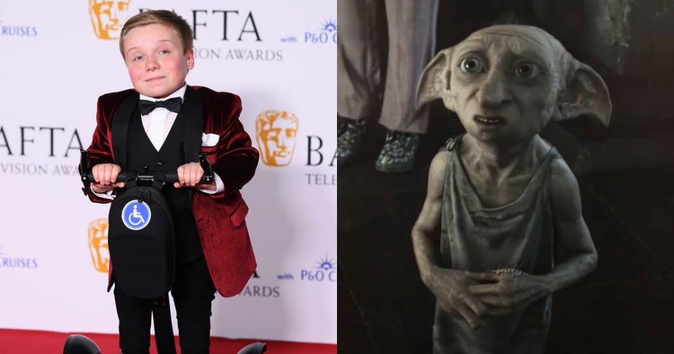 Young boy in a red velvet tuxedo jacket and bow tie standing on a mobility scooter on the red carpet at the BAFTA Television Awards.
