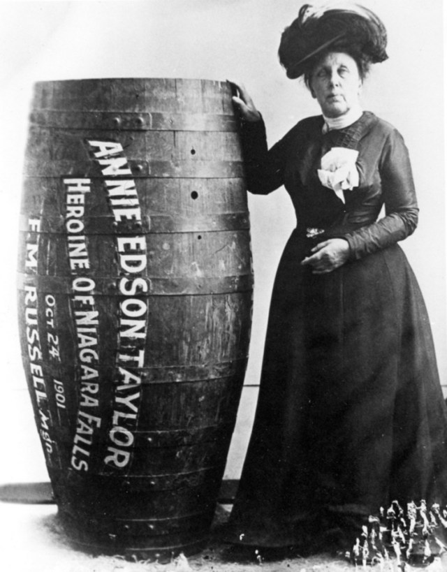 Annie Edson Taylor posing with her wooden barrel used in the 1901 Niagara Falls stunt