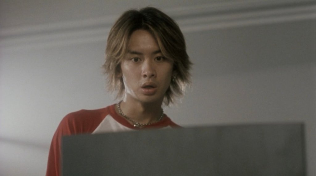 A dark, eerie still from the 2001 Japanese horror film Pulse